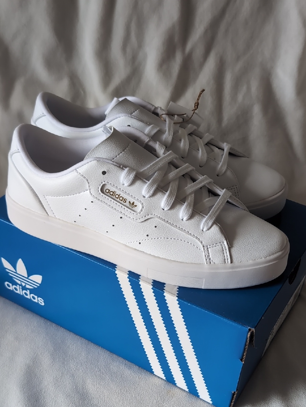 adidas White Low-Top Sneakers with Gold Logo
